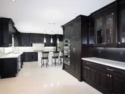 Light kitchen with dark furniture photo