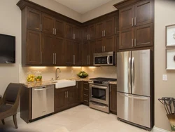 Light kitchen with dark furniture photo