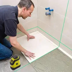 How to lay tiles on the bathroom floor photo