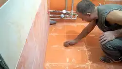 How to lay tiles on the bathroom floor photo