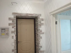 Finishing doorways with decorative stone photo in the apartment
