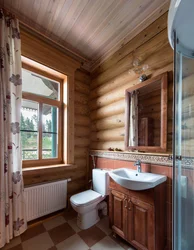 Window in the bathroom in a wooden house photo