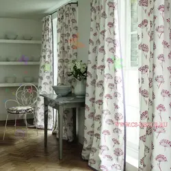 Curtains with flowers in the kitchen interior