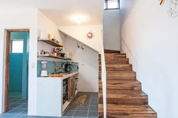 If the stairs are in the kitchen photo