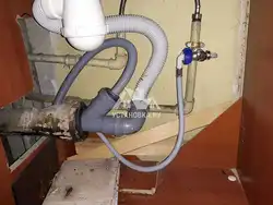 Photo of how to connect a washing machine in the kitchen