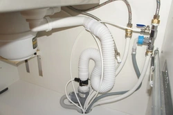 Photo of how to connect a washing machine in the kitchen