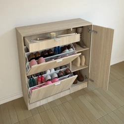 Shoe rack with drawer in the hallway photo