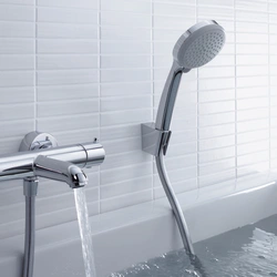 Bathroom faucet with watering can photo