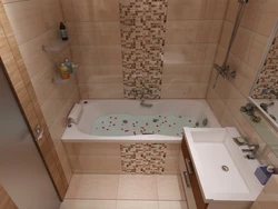 Bathtub design with tiles just above the bathtub