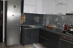 Graphite refrigerator in the kitchen interior
