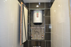 Photo of a small bathroom with a water heater