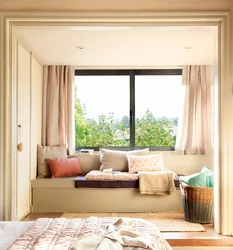 Bedroom interior with window sofa