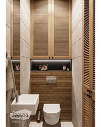 Design of a small toilet in an apartment with a cabinet