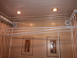 Hanger for drying clothes in the bathroom photo