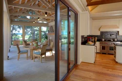 House projects with access to the terrace from the kitchen photo