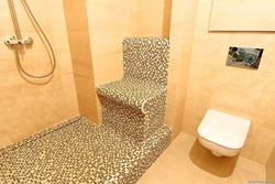 Do-it-yourself shower in an apartment made of tiles without a tray photo