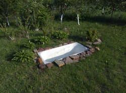 Cast iron bathtub in the countryside photo