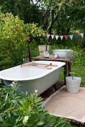 Cast iron bathtub in the countryside photo