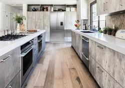 Concrete kitchen with wooden countertop in the interior