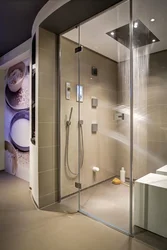 Photo Of A Bathroom With A Shower Behind Glass
