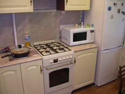 Kitchen with a regular gas stove photo