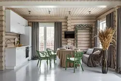 Kitchen design in a wooden house made of logs