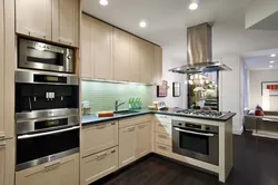 Kitchen Design With Built-In Refrigerator And Oven