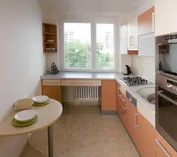 Kitchen Design With A Window In The Middle And A Radiator Under The Window