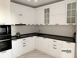 Countertops in the kitchen interior made of white gloss