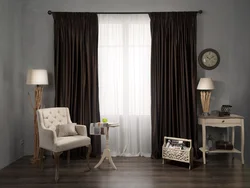 Curtains In The Interior Of The Living Room With Dark Furniture