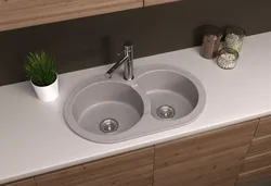 Kitchen with a round sink made of artificial stone photo