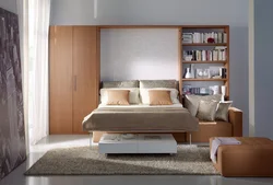 Wardrobe with sofa in bedroom photo