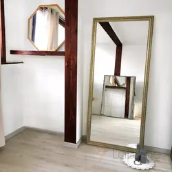Wall-mounted full-length mirror in the hallway photo