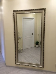 Wall-mounted full-length mirror in the hallway photo