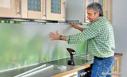 How to glue a panel to a wall in the kitchen photo