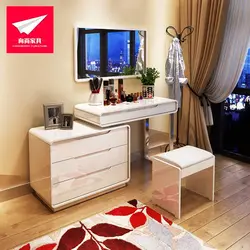 Dressing table with chest of drawers in the bedroom in the interior