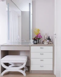 Dressing table with chest of drawers in the bedroom in the interior