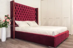 Photo of a bedroom with a fabric bed