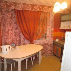 Photo of curtains for the kitchen if the wallpaper is orange