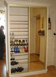 Shoe rack in the closet in the hallway photo