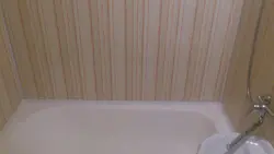 Finishing a bathroom in a wooden house with plastic panels photo