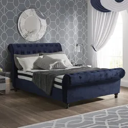 Soft blue bed in the bedroom interior