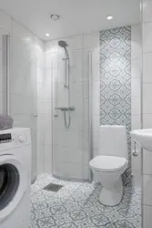 Interior of a small bathroom with toilet tiles