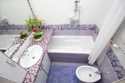 Interior of a small bathroom with toilet tiles