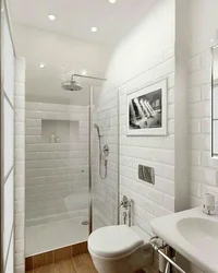 Interior of a small bathroom with toilet tiles
