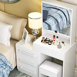 Bedroom interior with chest of drawers and dressing table