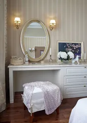 Bedroom interior with chest of drawers and dressing table