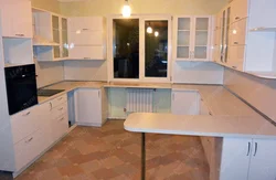 Shaped kitchens with a bar counter photo