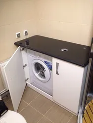 Cabinet for washing machine in bathroom photo
