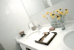White bathtub with mosaic photo
